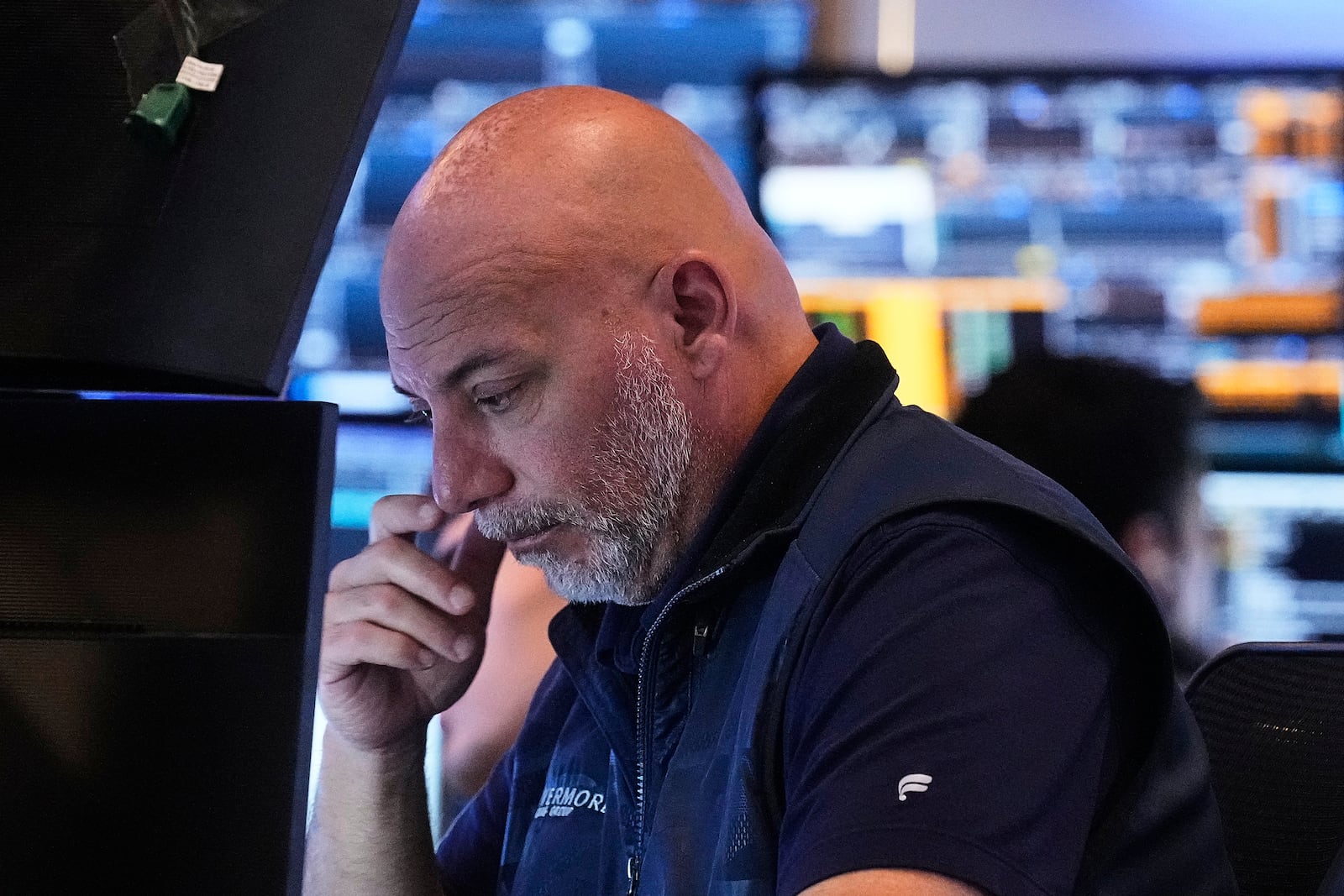 Trader Vincent Napolitano works on the floor of the New York Stock Exchange, Friday, July 18, 2025. (AP Photo/Richard Drew)
