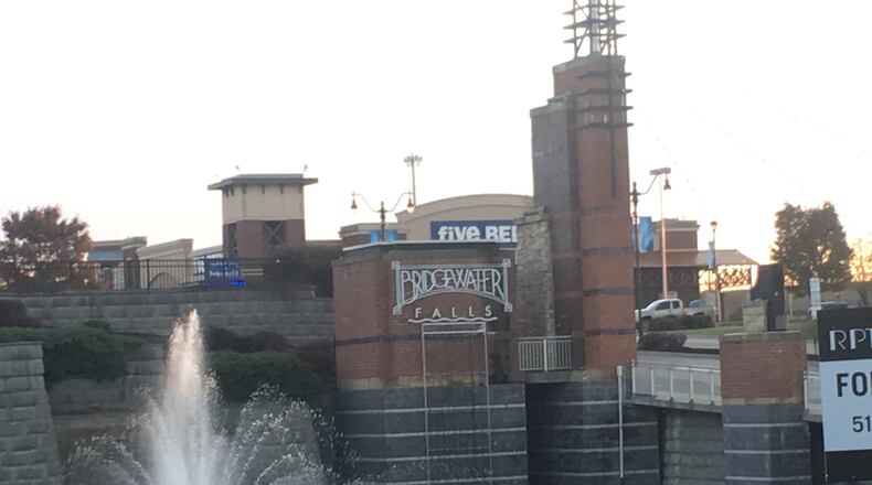 Bridgewater Falls Shopping Center in Fairfield Twp. will host the Fairfield Twp. Police Department’s on Saturday annual “Shop with a Cop” where three police officers will take nine children shopping for them and their families. MICHAEL D. PITMAN/STAFF