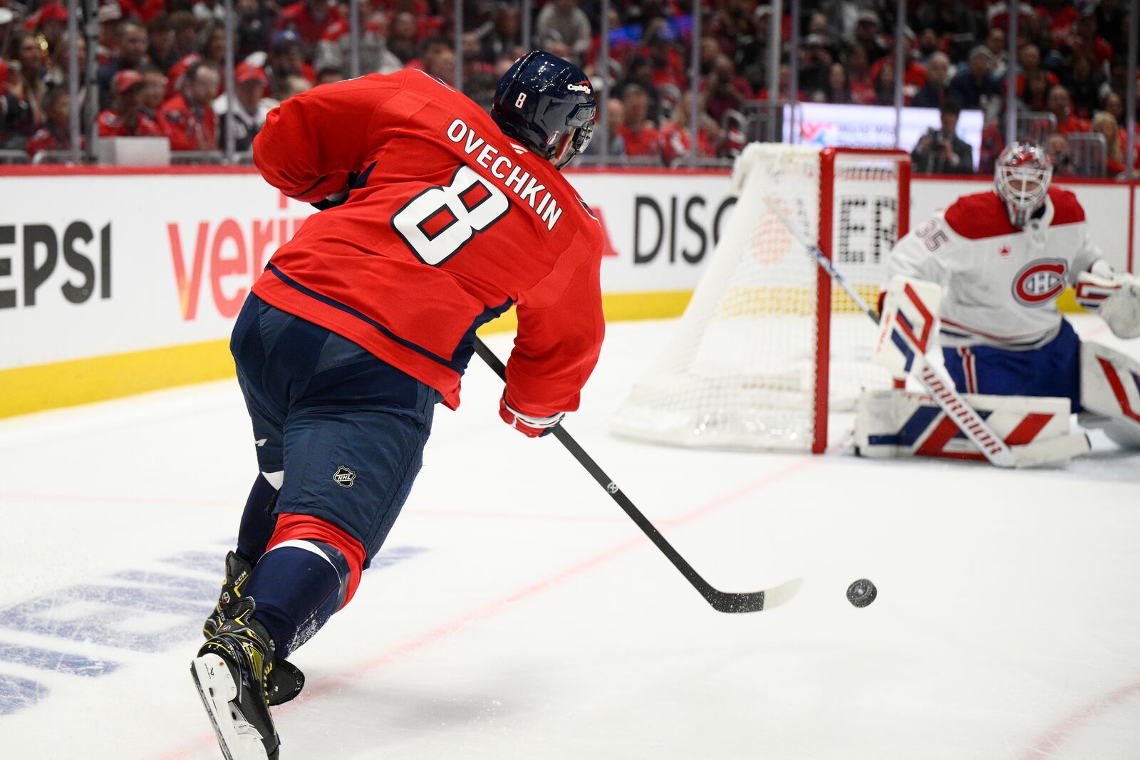 Washington Capitals left wing Alex Ovechkin (8) shoots against Montreal Canadiens goaltender Sam Montembeault (35) in the first period of Game 1 of a first-round NHL hockey playoff series Monday, April 21, 2025, in Washington. (AP Photo/Nick Wass)