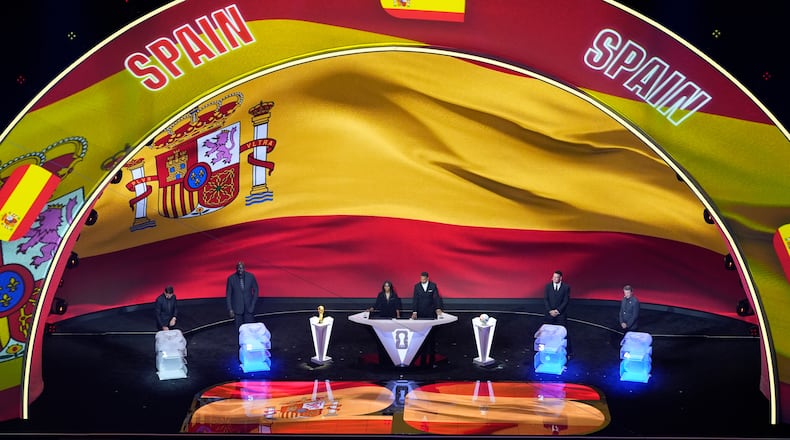 From left; former NFL player Tom Brady, former NBA player Shaquille O'Neal, broadcaster Samantha Johnson, former England soccer captain Rio Ferdinand, New York Yankees' Aaron Judge and former NHL player Wayne Gretzky participate in the draw for the 2026 soccer World Cup at the Kennedy Center in Washington, Friday, Dec. 5, 2025. (AP Photo/Alex Brandon)