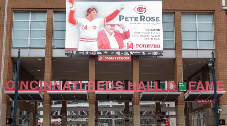 Thousands of Reds fans braved the steady rains to pay their respects to Cincinnati Reds legend and Major League Baseball’s all-time hits leader Pete Rose for a memorial visitation on Sunday, Nov. 10, 2024, at Great American Ball Park. Hosted by the Cincinnati Reds and Rose’s family, the visitation lasted 14 hours, a tribute to the “Hit King’s” jersey number. Rose died on Sept. 30 at the age of 83. TOM GILLIAM / CONTRIBUTING PHOTOGRAPHER