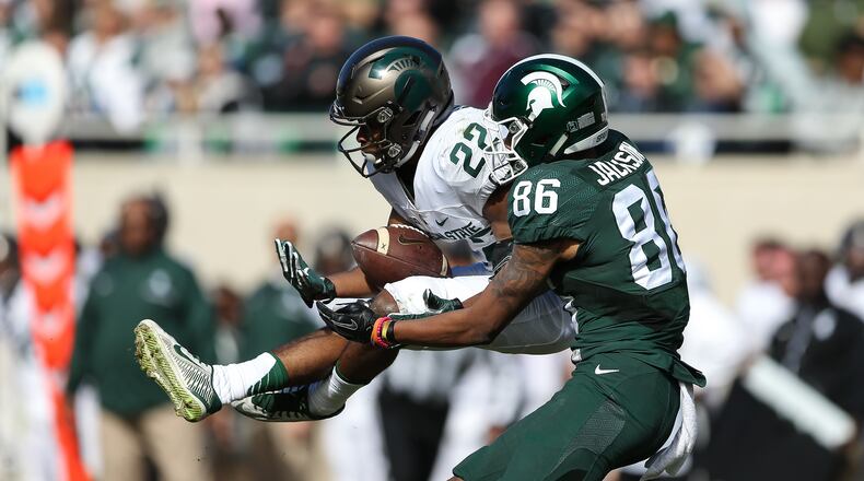 Fairfield High School graduate Josiah Scott (22) comes up with an interception during Michigan State’s spring football game April 1 in East Lansing, Mich. PHOTO COURTESY OF MICHIGAN STATE ATHLETICS