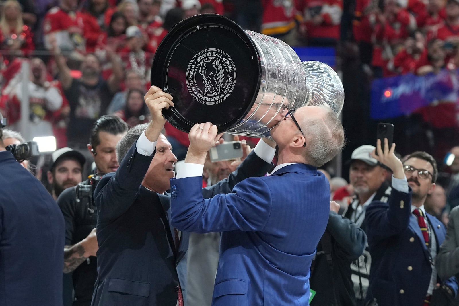 Florida Panthers head coach Paul Maurice kisses the Stanley Cup trophy after defeating the Edmonton Oilers in Game 6 of the NHL hockey Stanley Cup Final Tuesday, June 17, 2025, in Sunrise, Fla. (AP Photo/Lynne Sladky)