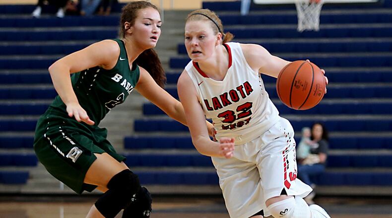 Lakota West’s Abby Prohaska looks for a way past Badin’s Shelby Nusbaum during the inaugural All-Butler County All-Star girls basketball game at the Hamilton Athletic Center on Apr. 15, 2017. E.L. HUBBARD / CONTRIBUTED