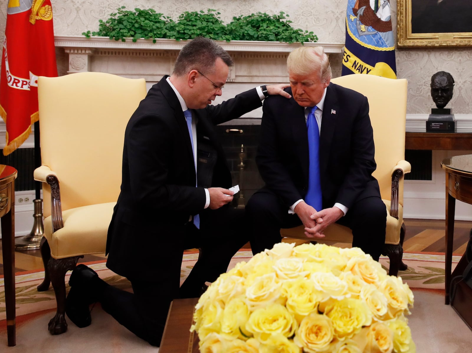 President Donald Trump prays with pastor Andrew Brunson in the Oval Office of the White House, Oct. 13, 2018, in Washington. (AP Photo/Jacquelyn Martin, File)