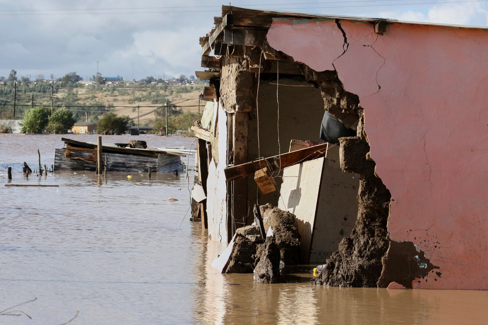 A view of homes submerged in floodwater, in Mthatha, South Africa, Tuesday, June 10, 2025. (AP Photo/Hoseya Jubase)