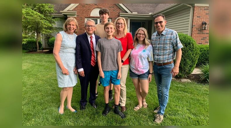 Gov. Mike DeWine and first lady Fran DeWine visited with Joseph Costello, center, who won the first of five full-ride scholarships May 26, 2021, as part of the Ohio Vax-a-Million lottery.