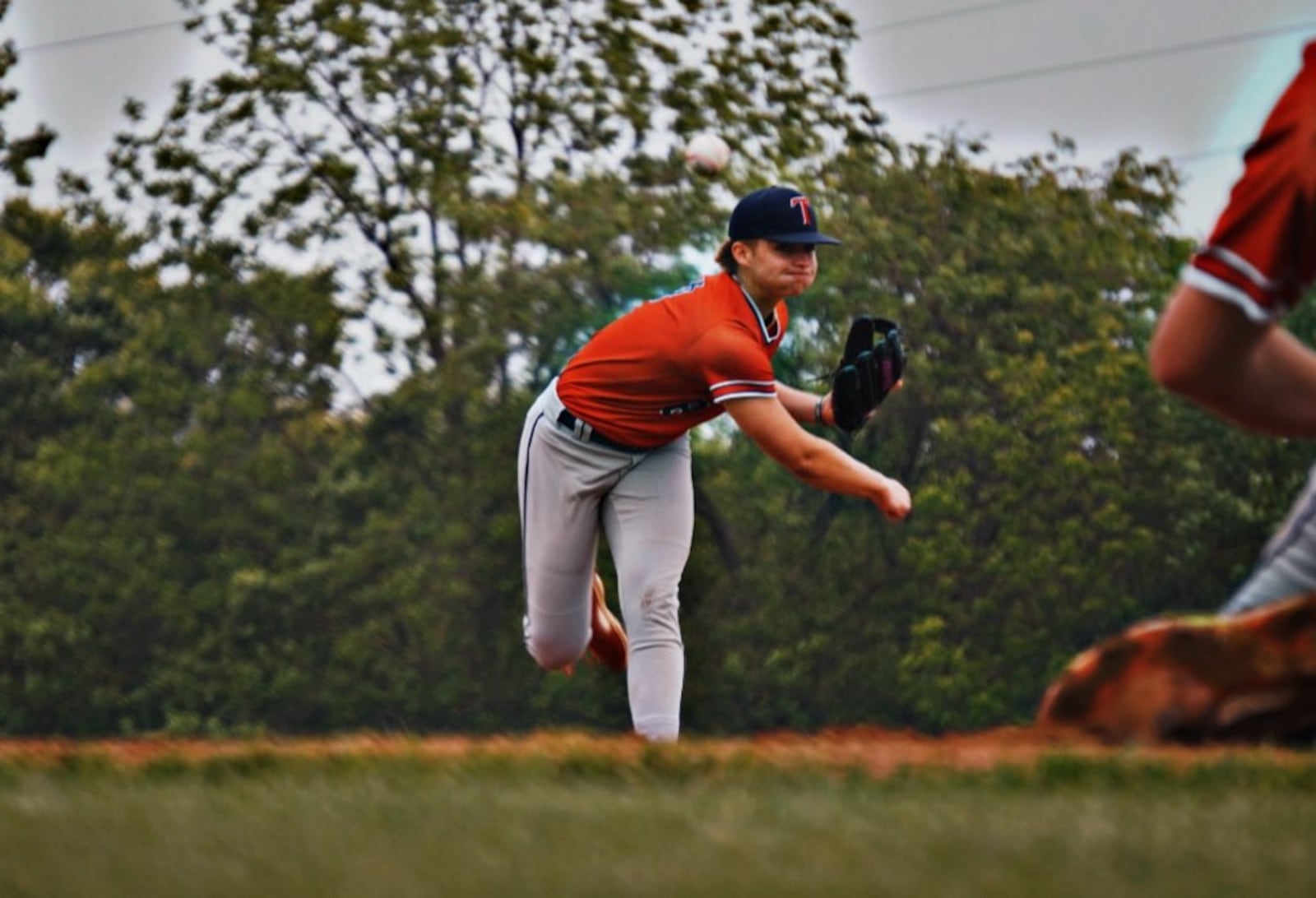 Talawanda's Nathaniel Iden sends a pitch to the plate during his Division III tournament game against Monroe on Wednesday. CHRIS VOGT / CONTRIBUTED