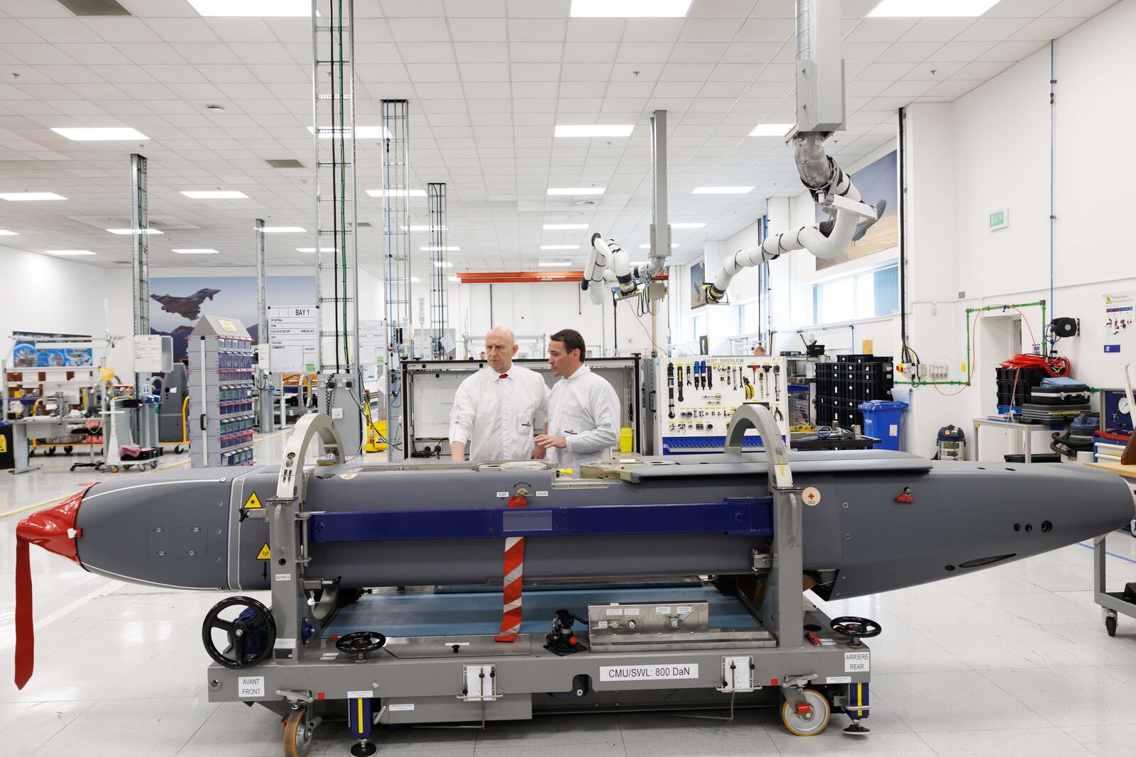 Director of Mechanical Engineering Matt Beamont, right, shows Britain's Defence Secretary John Healey a storm shadow missile on an assembly line at the MBDA Storm Shadow factory in Stevenage, England, Saturday May 31, 2025. (Dan Kitwood/Pool via AP)