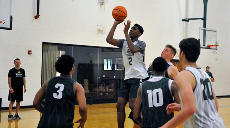 Wright State freshman Malachi Smith puts up a shot during Tuesday’s team workout at Setzer Pavilion. JAY MORRISON/STAFF
