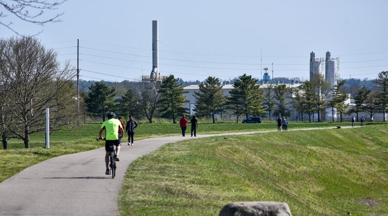 A sunny day brought a lot of people out to the bike path along the Great Miami River Wednesday, April 22 in Hamilton. NICK GRAHAM / STAFF