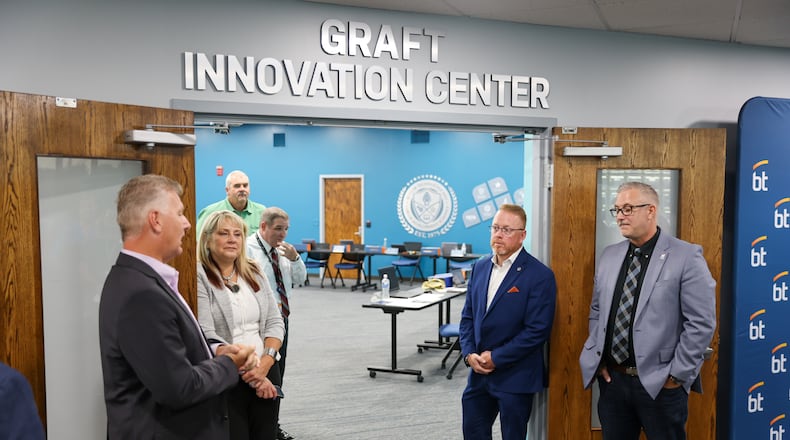 Jon Graft (right), superintendent of Butler Tech from 2016 until his retirement in the spring this year, was center of attention by the board recently as they unveiled the “Graft Innovation Center” to him at the district’s headquarters on the D. Russel Lee campus in Fairfield Twp. (Provided)