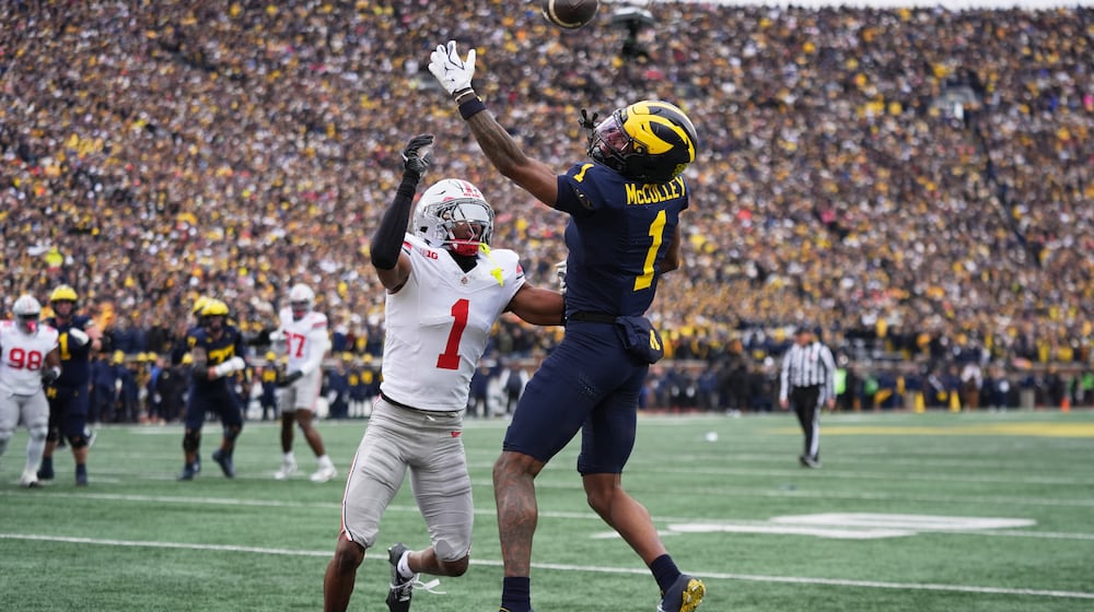 Michigan wide receiver Donaven McCulley, right, is unable to catch a pass against Ohio State Buckeyes cornerback Davison Igbinosun during the first half of an NCAA college football game, Saturday, Nov. 29, 2025, in Ann Arbor, Mich. (AP Photo/Ryan Sun)