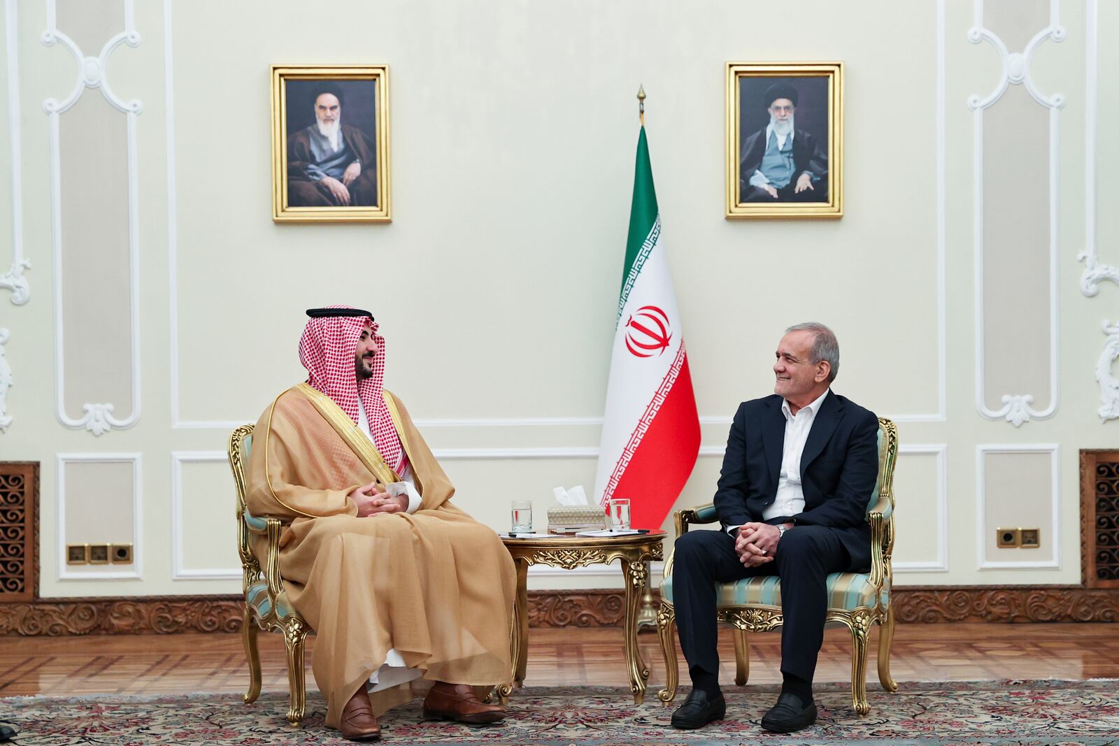 In this photo released by the Iranian Presidency Office, President Masoud Pezeshkian, right, meets with Saudi Arabia's Defense Minister Prince Khalid bin Salman, in Tehran, Iran, Thursday, April 17, 2025. (Iranian Presidency Office via AP)