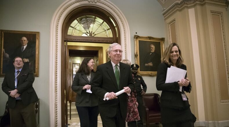 Senate Majority Leader Mitch McConnell, R-Ky., leaves the chamber after announcing an agreement in the Senate on a two-year, almost $400 billion budget deal that would provide Pentagon and domestic programs with huge spending increases, at the Capitol in Washington, Wednesday, Feb. 7, 2018. (AP Photo/J. Scott Applewhite)
