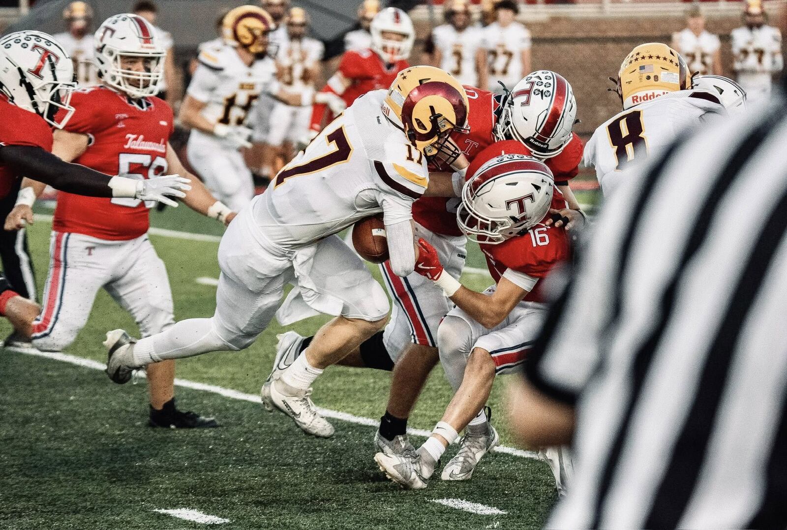 Ross ball carrier Carter Gipson rushes against Talawanda last week at Talawanda High School. JORDAN PHILLIPS / CONTRIBUTED