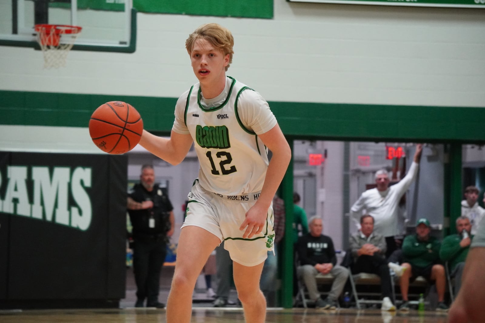 Badin’s Cade Cummins dribbles the ball up court against Edgewood on Monday night at Mulcahey Gym in Hamilton. CHRIS VOGT / CONTRIBUTED