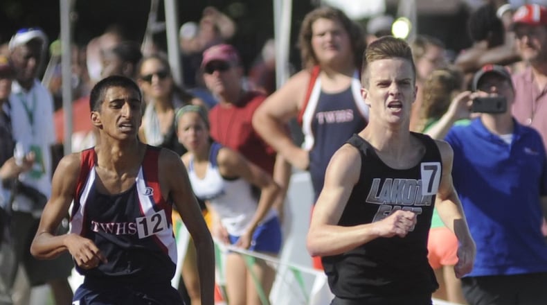 Lakota East’s Dustin Horter (right) retakes the lead and wins the 1,600 meters (4:08.38) during Saturday’s Division I state track and field meet at Ohio State University’s Jesse Owens Memorial Stadium in Columbus. MARC PENDLETON/STAFF