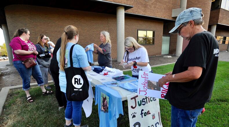 Protesters gathered outside Middletown Municipal Court on Friday, Aug. 9, 2019, for the arraignment of Charles Miller, who is charged with cruelty to a companion animal after allegedly hitting a German Shepherd in the head with a bat, and the dog later died. NICK GRAHAM / STAFF