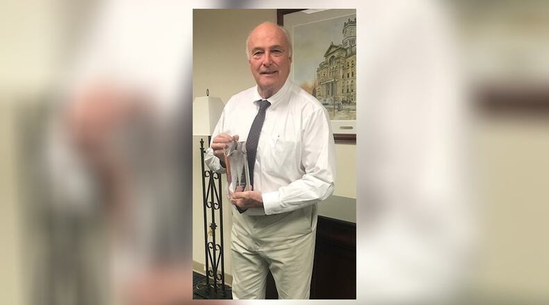 Butler County Prosecutor Mike Gmoser has been honored by the Coalition Against Insurance Fraud for two notable arson cases, including the conviction in the death of Hamilton firefighter Patrick Wolterman.