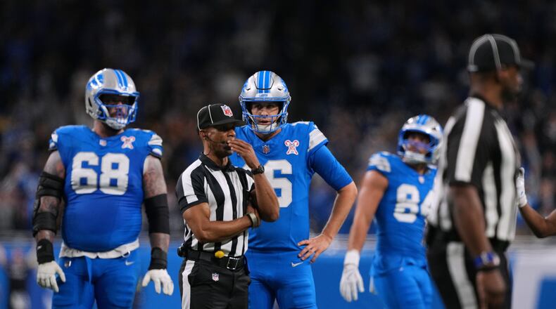 Detroit Lions' Jared Goff (16) waits for a call on the final play of an NFL football game against the Pittsburgh Steelers, Sunday, Dec. 21, 2025, in Detroit. (AP Photo/Ryan Sun)