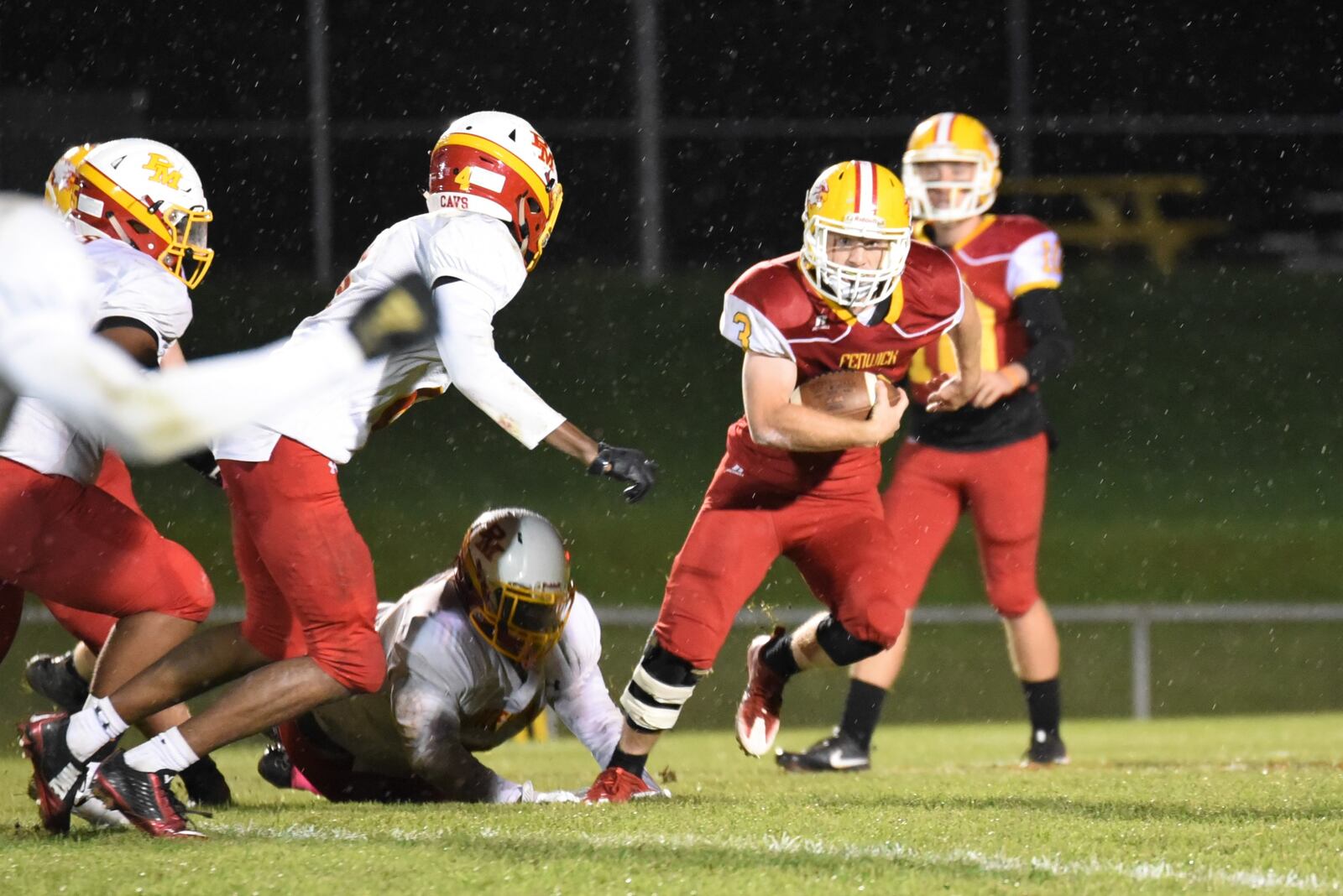 Fenwick’s Jack Fessler takes off on a run during his 203-yard, three-touchdown performance Friday night in a 31-14 win over visiting Purcell Marian at Krusling Field in Middletown. CONTRIBUTED PHOTO BY ANGIE MOHRHAUS