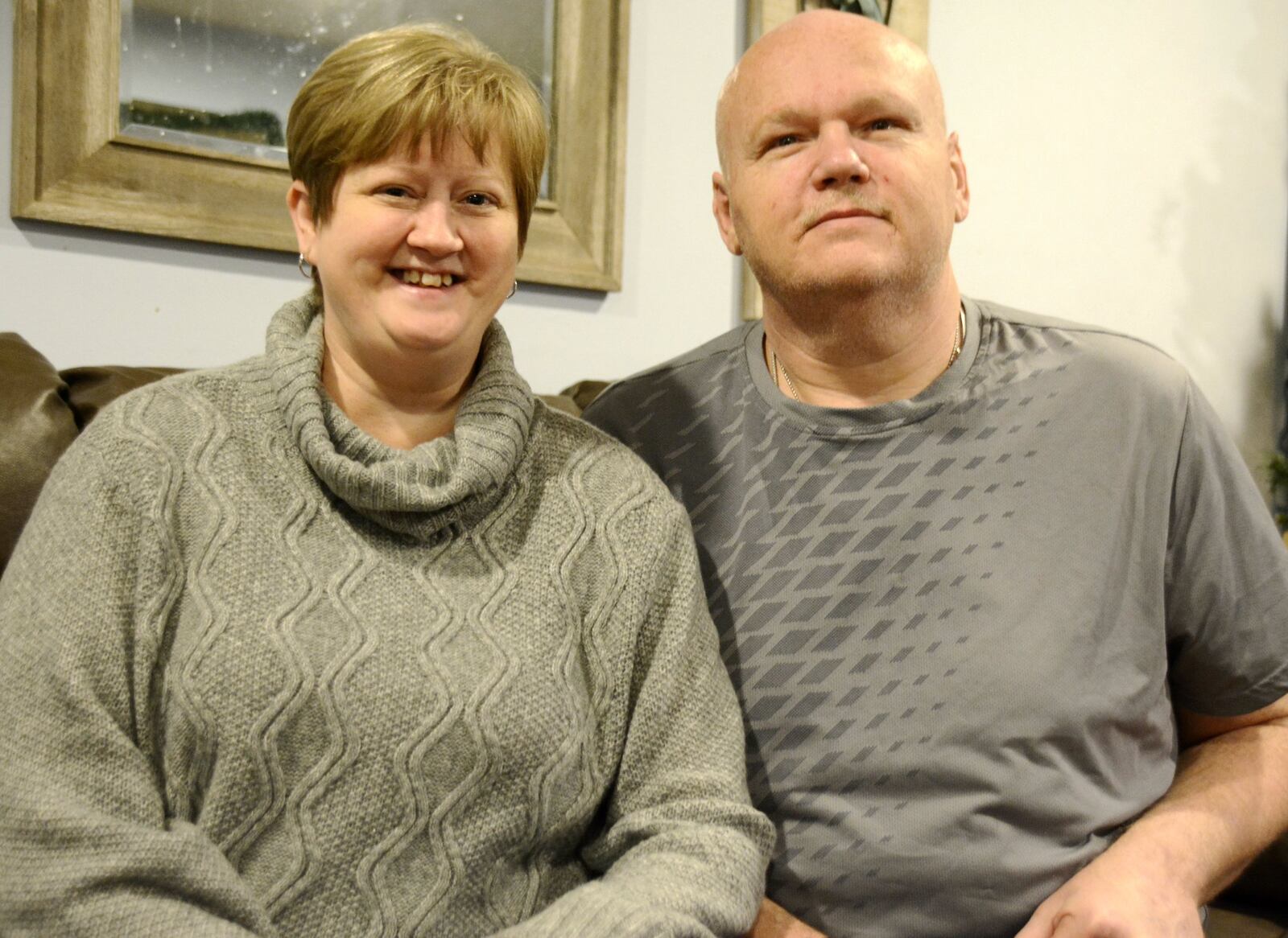 Keli Thorn, left, is in need of a new kidney, and her husband, Aaron, has been spreading the word about his wife’s need on social media and out around Butler County. Keli was diagnosed with polycystic kidney disease, a genetic kidney disease she had before her 2009 diagnosis. Pictured are Keli and Aaron in the Fairfield Twp. home on Dec. 31, 2019. MICHAEL D. PITMAN/STAFF