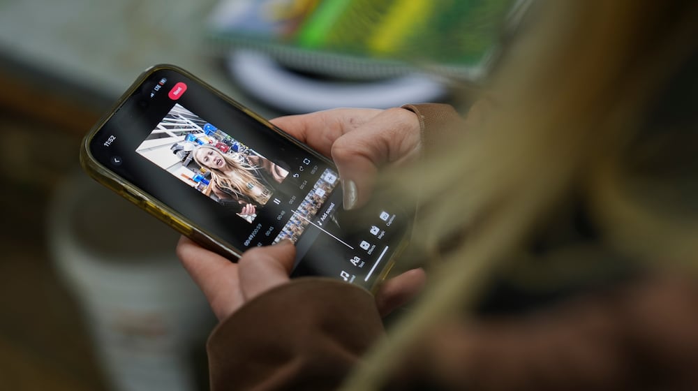 FILE - Zoe Kent edits a social media video on the TikTok app, Jan. 20, 2025, at her farm in Bucyrus, Ohio. (AP Photo/Joshua A. Bickel, File)