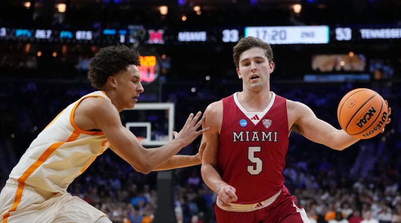 Miami (Ohio)'s Peter Suder, right, tries to get past Tennessee's Nate Ament during the second half in the first round of the NCAA college basketball tournament, Friday, March 20, 2026, in Philadelphia. (AP Photo/Matt Slocum)