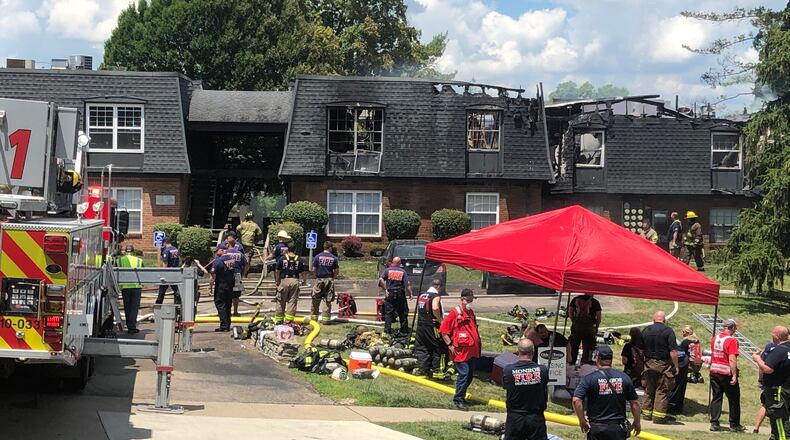 The American Red Cross provided canteen services to firefighters who battled an apartment fire in Middletown for several hours this week. The Red Cross also provided lodging to about 20 residents who were displaced by the fire. RICK McCRABB/STAFF