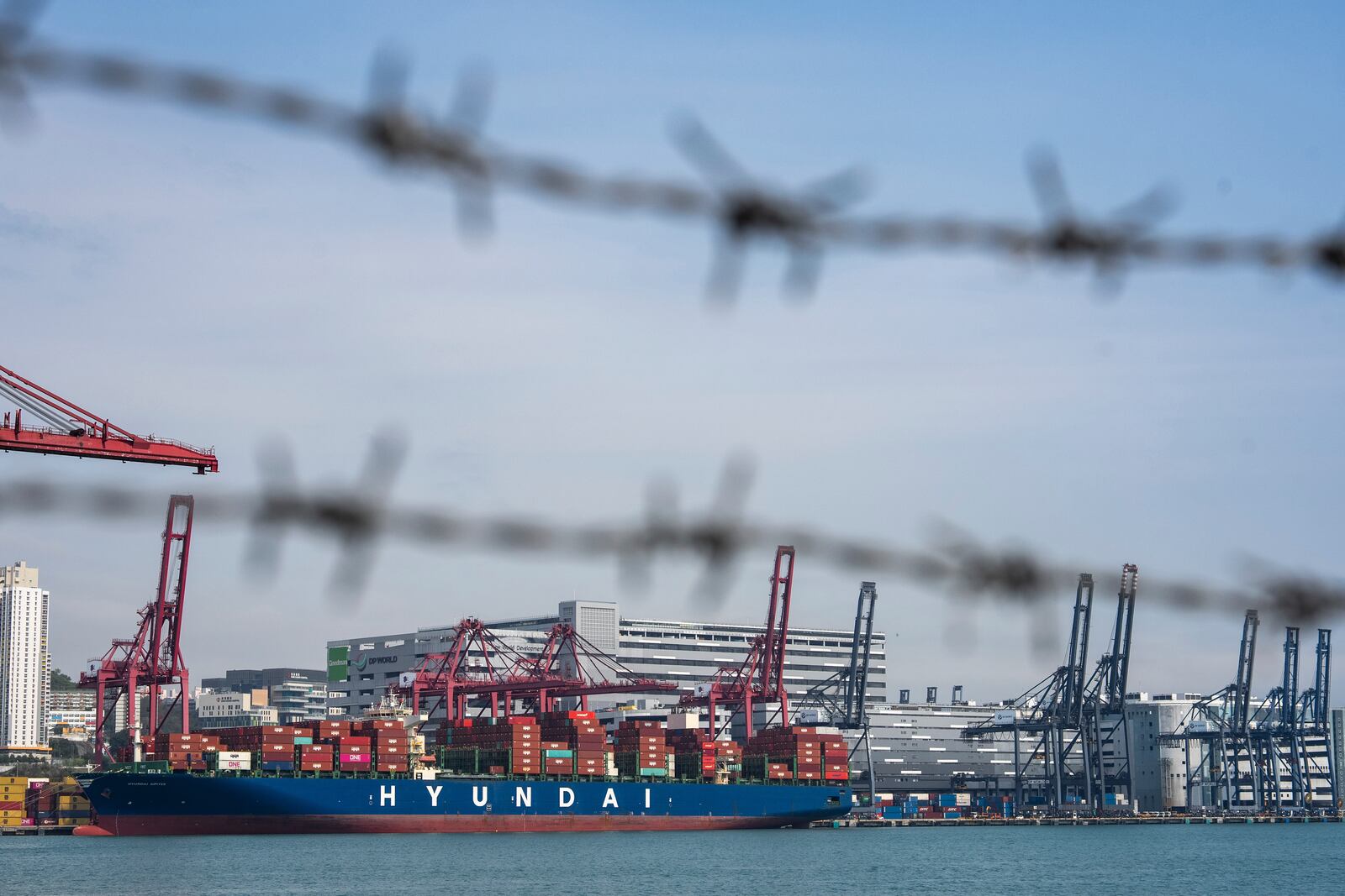 Container ship is docked at Kwai Chung Container terminal in Hong Kong, Tuesday, Apr. 8, 2025. (AP Photo/Chan Long Hei)