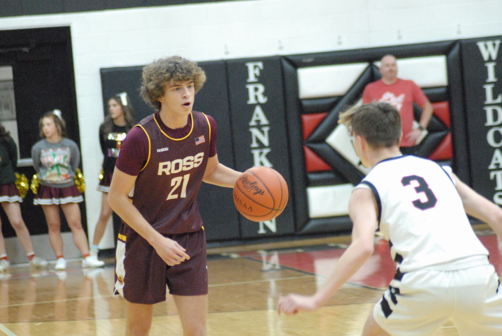 Ross junior Will Schaefer is guarded by Franklin senior Jace Murphy during Friday night's game at Franklin. Chris Vogt/CONTRIBUTED
