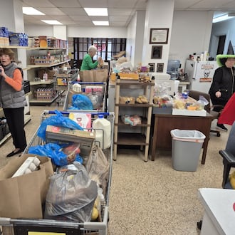 Volunteers load food and other goods at the Franklin Area Community Services Food Pantry. Demand for help is up in spite of federal rulings that the SNAP program must be funded during the government shutdown. MICHAEL KURTZ/STAFF