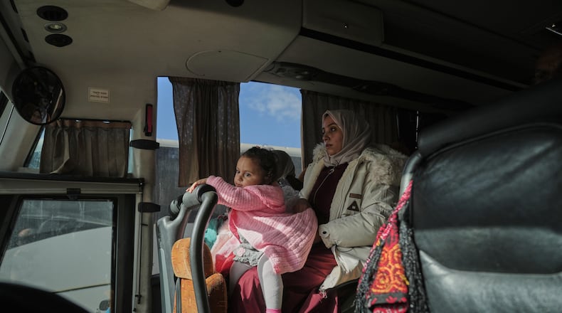 Palestinian patients ride a bus in Khan Younis as they travel to the Rafah crossing to leave the Gaza Strip for medical treatment abroad, Tuesday, Feb. 3, 2026. (AP Photo/Jehad Alshrafi)