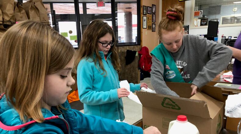 Local residents gave a Darke County grocery a helping hand on Saturday, Nov. 23. CONTRIBUTED