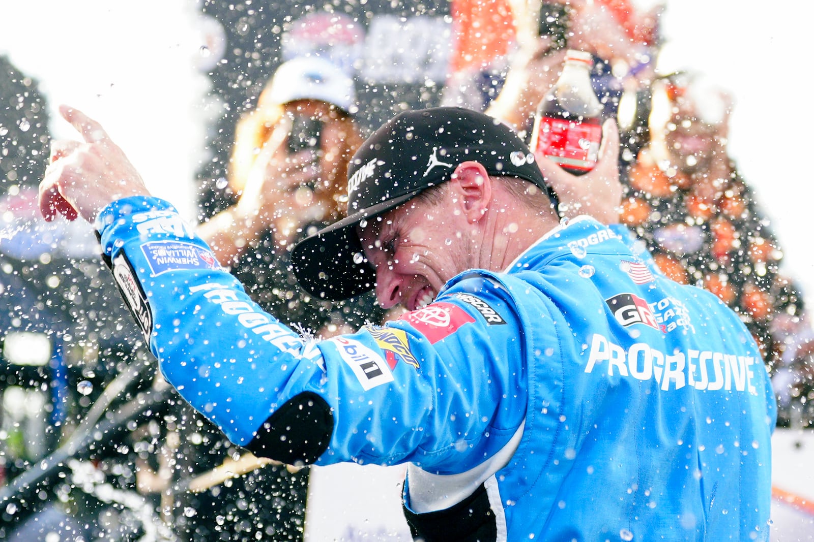 Denny Hamlin celebrates in Victory Lane after winning a NASCAR Cup Series auto race at Dover Motor Speedway, Sunday, July 20, 2025, in Dover, Del. (AP Photo/Derik Hamilton)