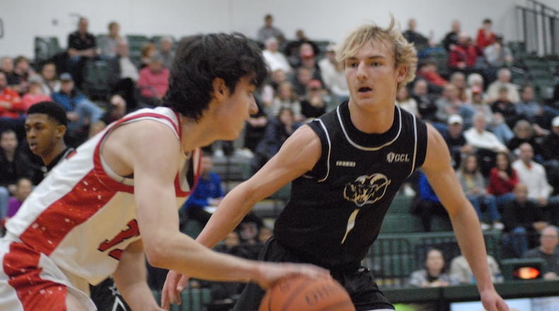 Badin's Cooper Ollis (1) supplies the defense on Indian Hill's Zach Jones (32) on Saturday at Mason. Chris Vogt/CONTRIBUTED
