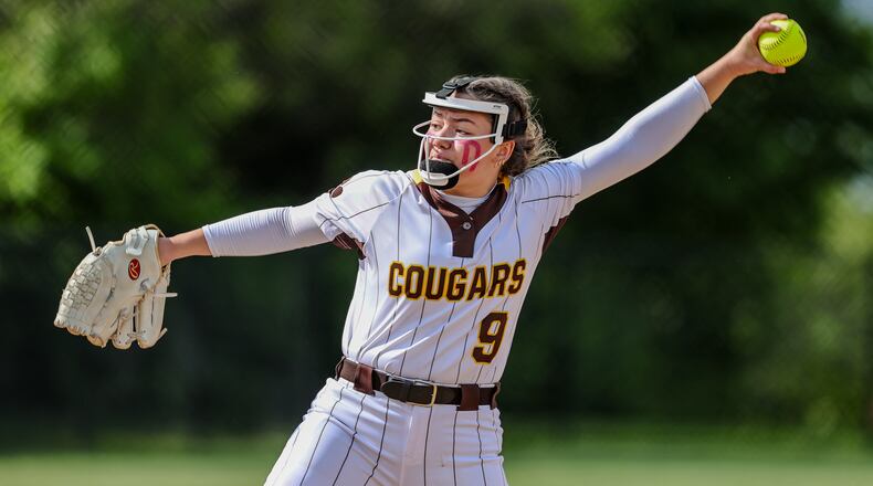 Kenton Ridge High School freshman Ivee Rastatter delivers a pitch to the plate during their Division IV district final game against CHCA on Friday, May 23 at Valley View High School. The Cougars won 11-0. MICHAEL COOPER / STAFF