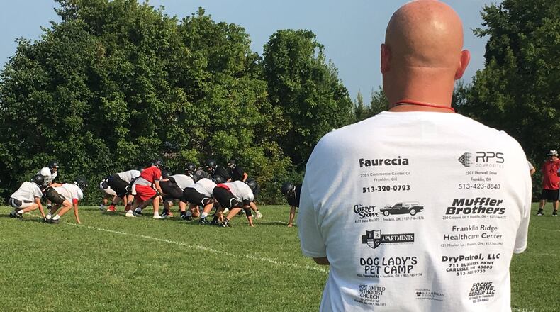 The Franklin Wildcats are under the watchful gaze of head coach Brad Childers during a recent practice at the school. RICK CASSANO/STAFF