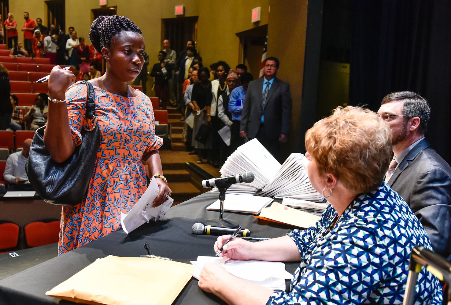 Nearly 100 people become U.S. citizens at naturalization ceremony at Miami Hamilton