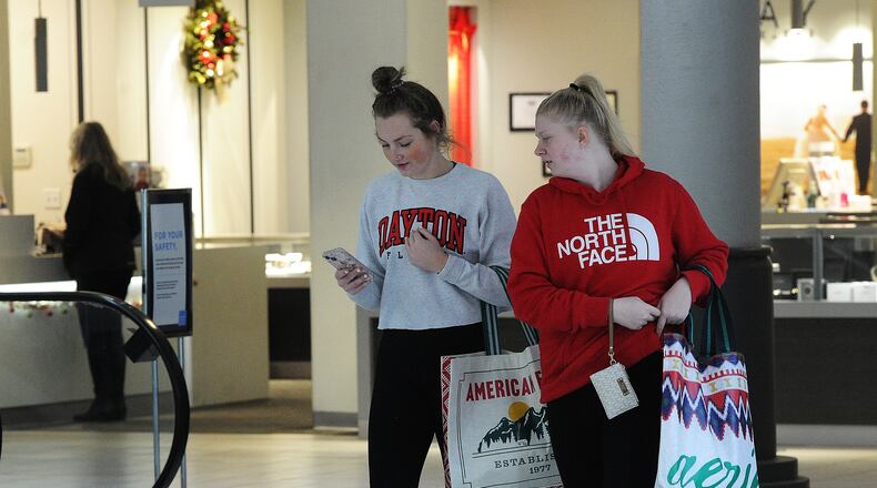Jillian McIntosh, left and Courtney Furnas, shop at the Dayton Mall in this file photo. This year’s sales tax holiday — running for 10 days from midnight on July 30 to a minute before midnight on Aug. 8 — will feature a considerably longer list of purchases eligible for sales tax relief. MARSHALL GORBY\STAFF