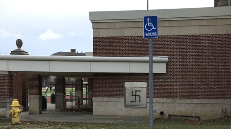 Swastikas, racist words and homophobic slurs were painted near the football field of Withrow High School in Hyde Park over the weekend. WCPO