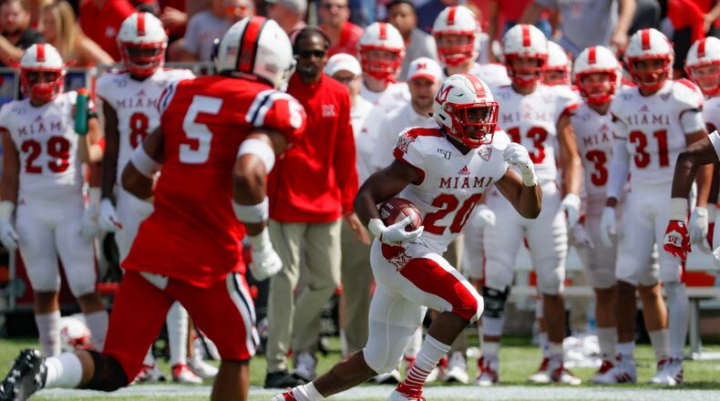 Miami of Ohio running back Tyre Shelton (20) runs the ball in the first half of an NCAA college football game against Cincinnati, Saturday, Sept. 14, 2019, in Cincinnati. (AP Photo/John Minchillo)
