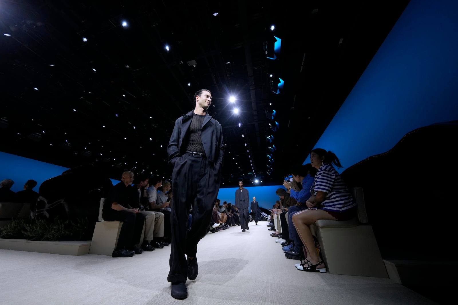 A model wears a creation as part of the men's Giorgio Armani Spring-Summer 2026 collection, that was presented in Milan, Italy, Monday, June 23, 2025. (AP Photo/Luca Bruno)