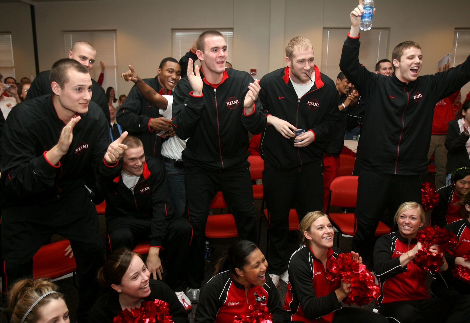 Miami basketball players in the front row, l-r Tyler Dierkers, Michael Bramos, Adam Fletcher, Monty St. Clair and Doug Penno react to the news that they will be playing Oregon in the NCAA tournament in March of 2007. GREG LYNCH / STAFF