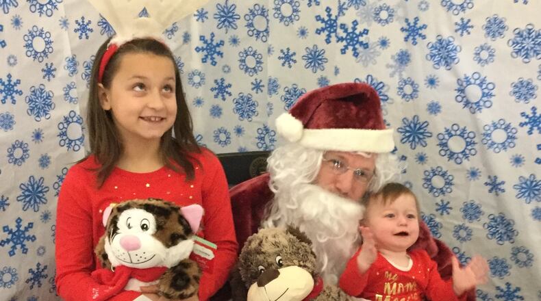 The Warren County Board of Developmental Disabilities Early Intervention Division held their annual holiday party for enrolled children and their families. Aliyha, age 9, and Freya, age 1, enjoyed the Breakfast With Santa event held in Warren County. The WCBDD will host an open house March 2 to share information about their services. CONTRIBUTED