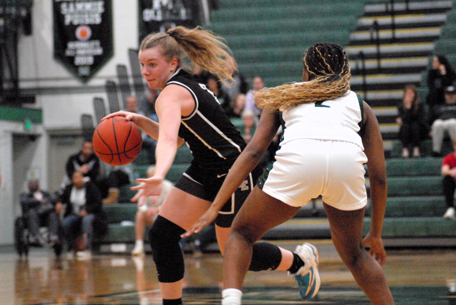 Lakota East's Emma Fohl is guarded by Mason's Adaia Kesler on Saturday afternoon. Chris Vogt/CONTRIBUTED