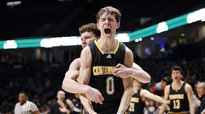 Centerville's Gabe Cupps jumps up with emotion after making a fade away shot and drawing a foul during their Division I regional basketball game against Kettering Fairmont Wednesday, March 9, 2022 at Cintas Center on the Xavier University campus in Cincinnati. Centerville won 44-42. GRAHAM/STAFF