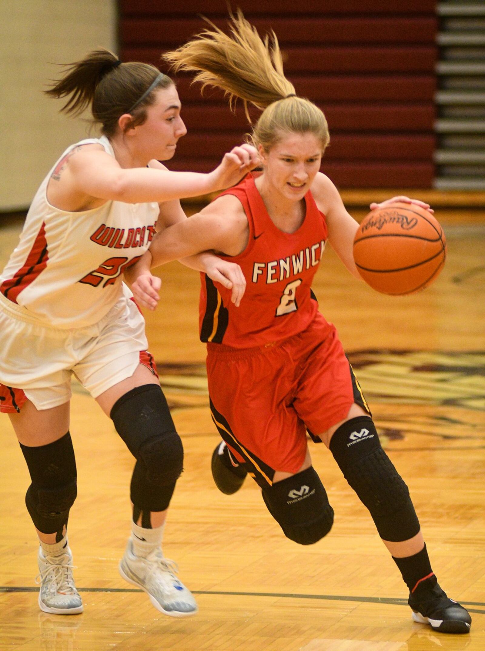 Fenwick’s Hannah Tebbe (2) drives on Franklin’s Skyler Weir during Monday night’s Division II district basketball semifinal at Lebanon. Franklin won 47-35. ROB MCCULLEY/RAM PHOTOGRAPHY