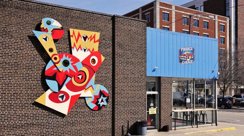 A community art project mural was created with the help of Inspiration Studios with the final project being installed at Pinball Garage in Hamilton. NICK GRAHAM/STAFF